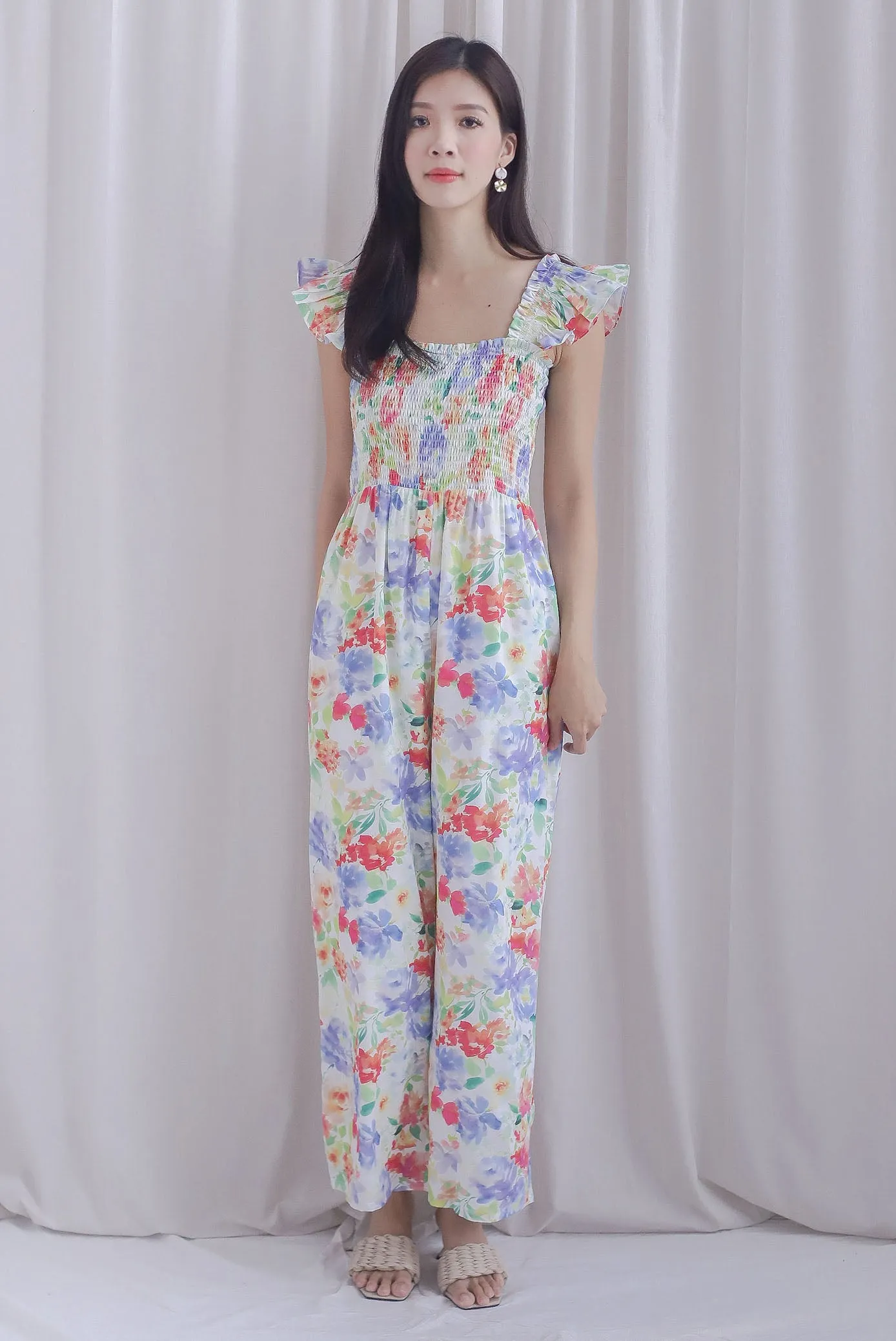 Archie Ruffle Strap Smocked Jumpsuit In Vibrant Floral