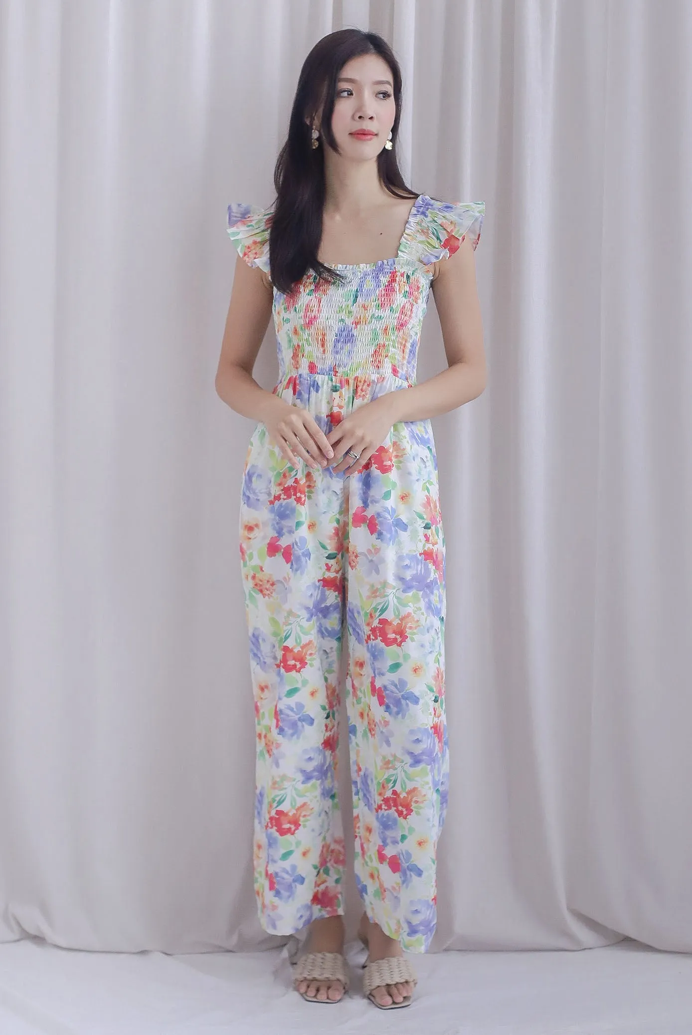 Archie Ruffle Strap Smocked Jumpsuit In Vibrant Floral