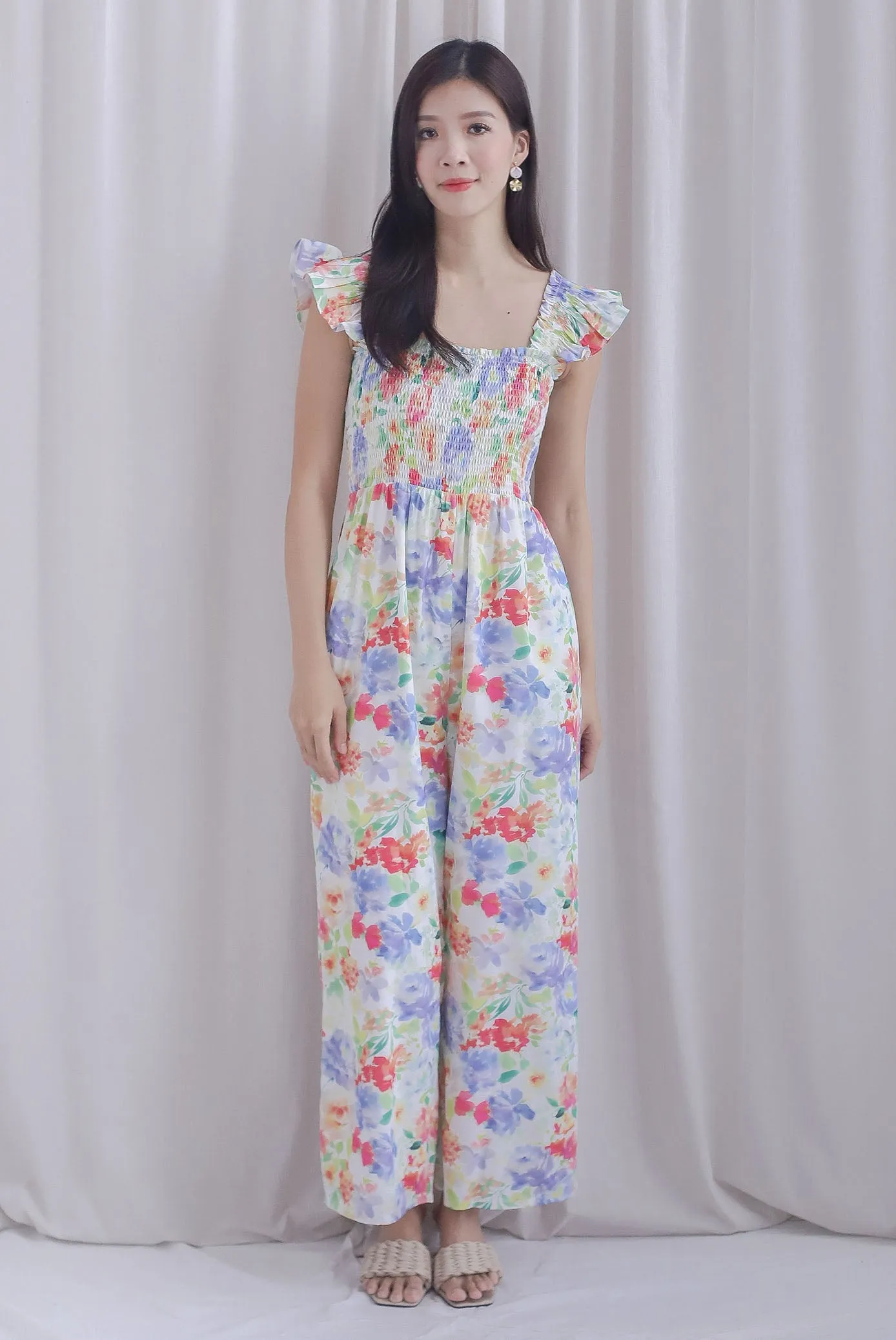 Archie Ruffle Strap Smocked Jumpsuit In Vibrant Floral