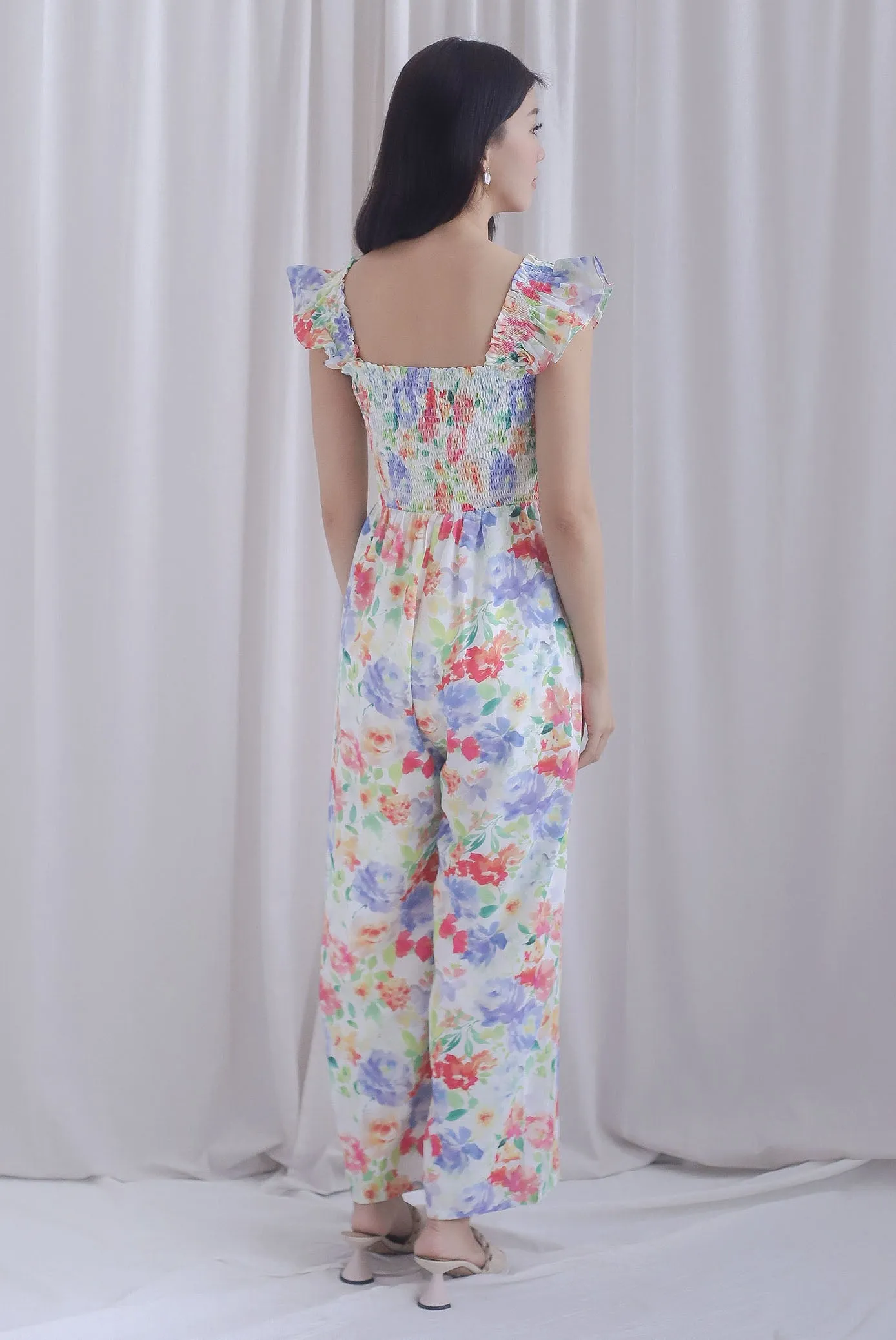 Archie Ruffle Strap Smocked Jumpsuit In Vibrant Floral